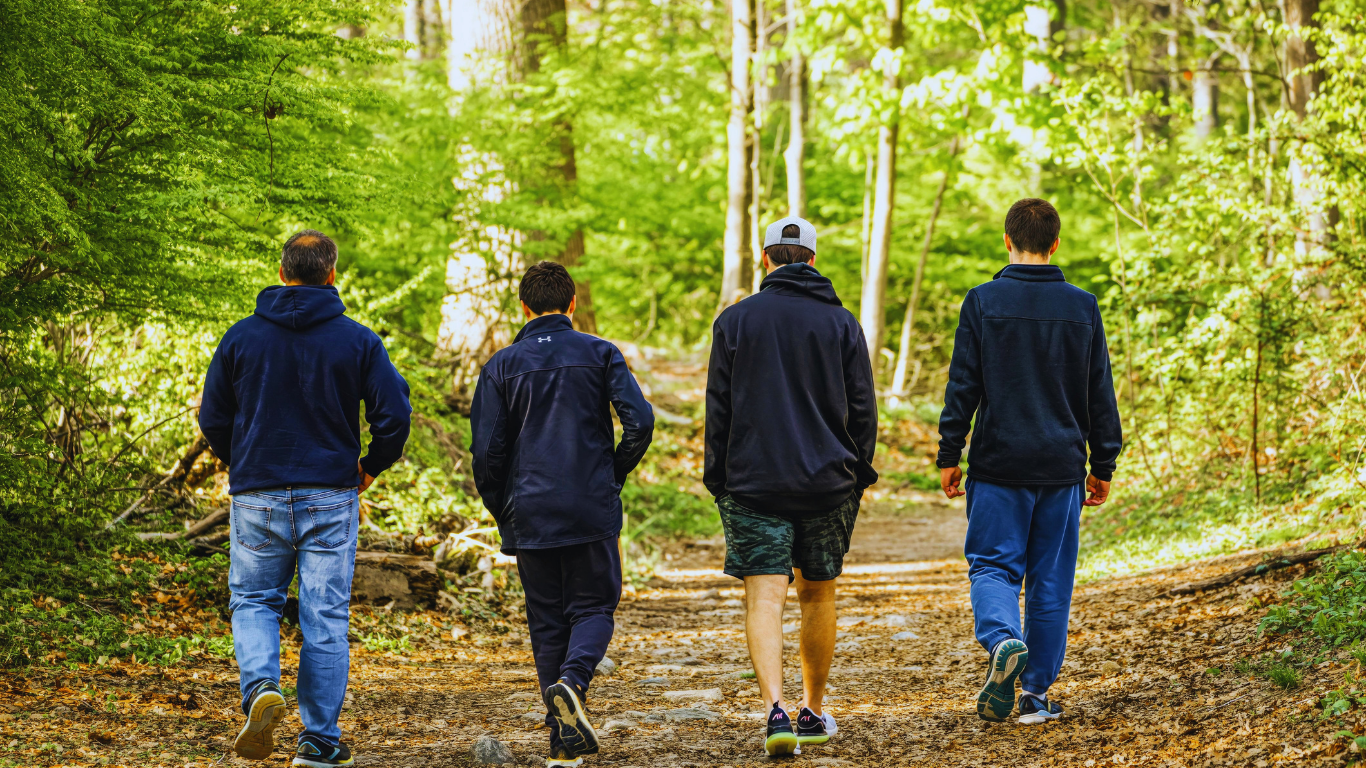 men walking in the woods